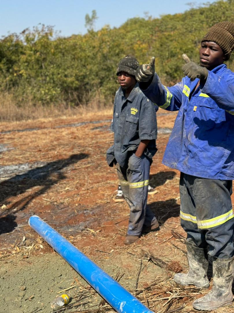 Team on site with borehole casing